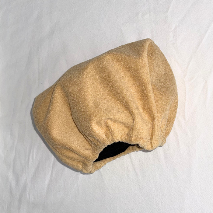 Beige dog car headrest cover - angle view