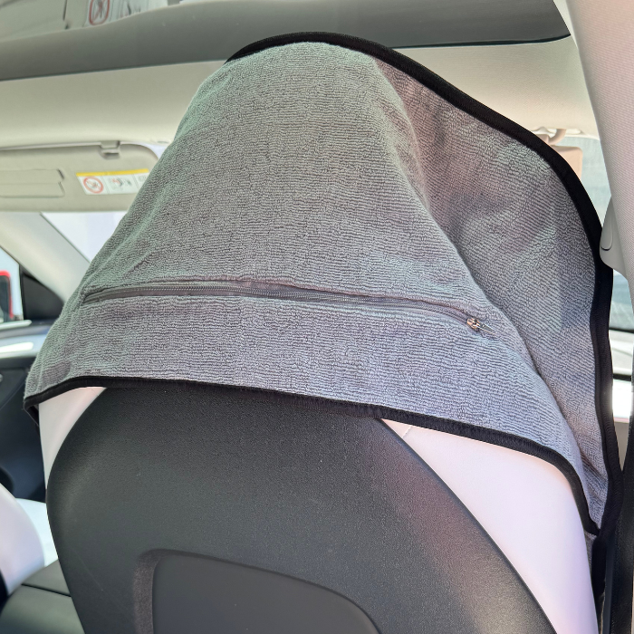 Grey hooded gym towel with hood up in car