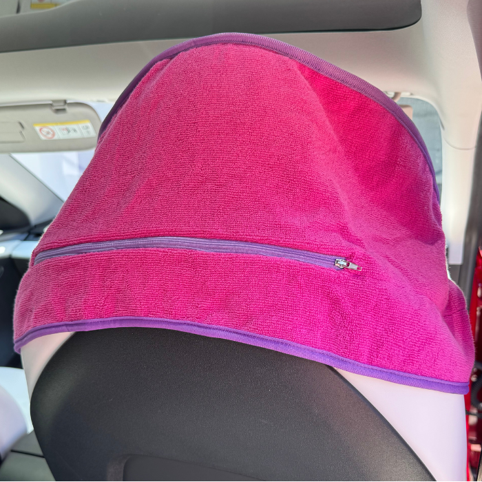 Pink hooded gym towel with hood up in car