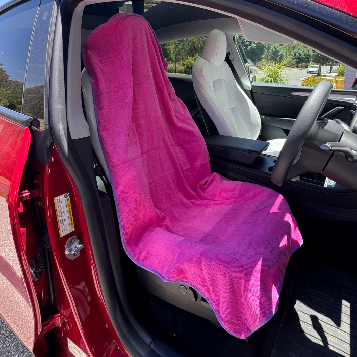 Pink hooded gym towel in car