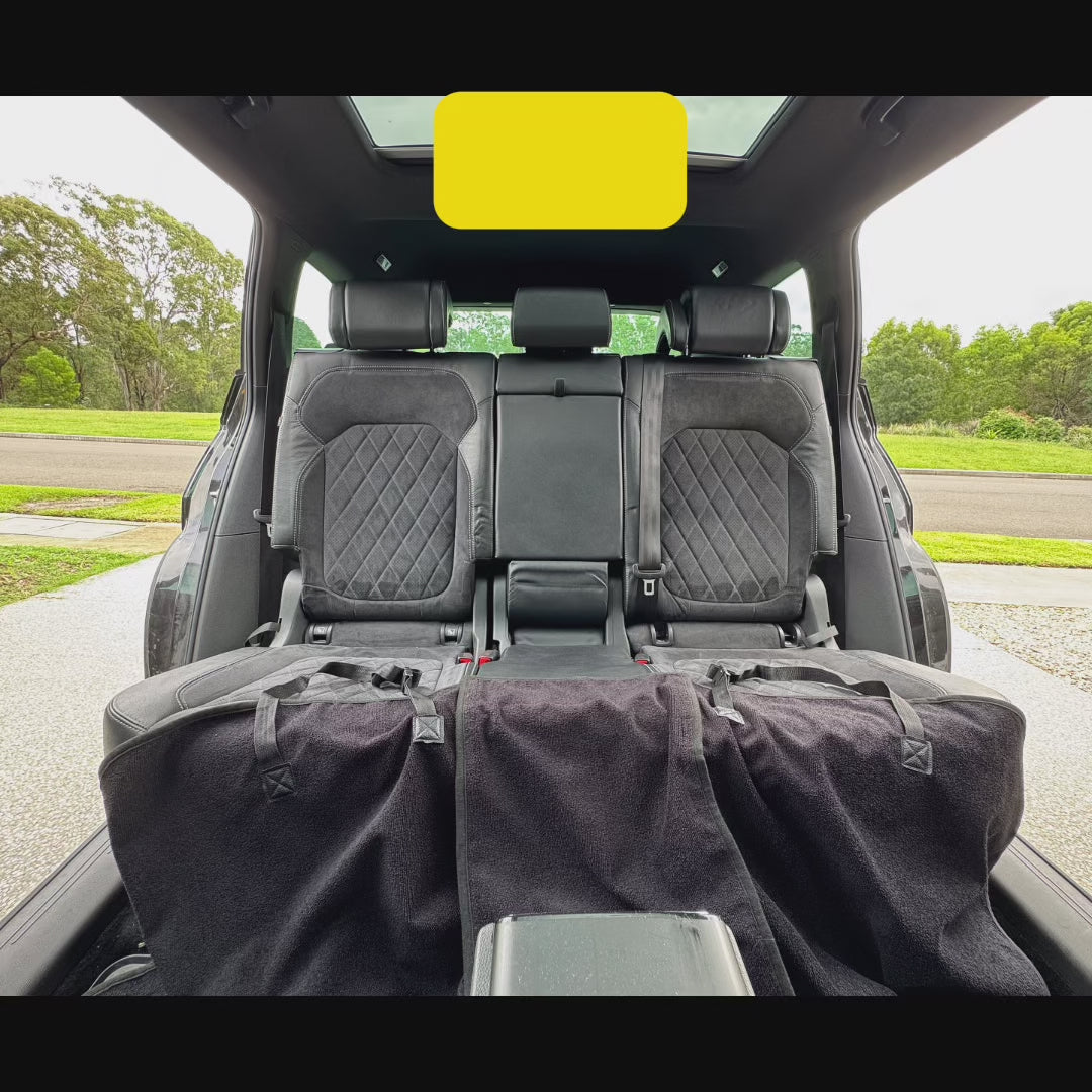 Load video: Back Seat Hoodie | Dog Car Seat Cover with Middle Seat Access